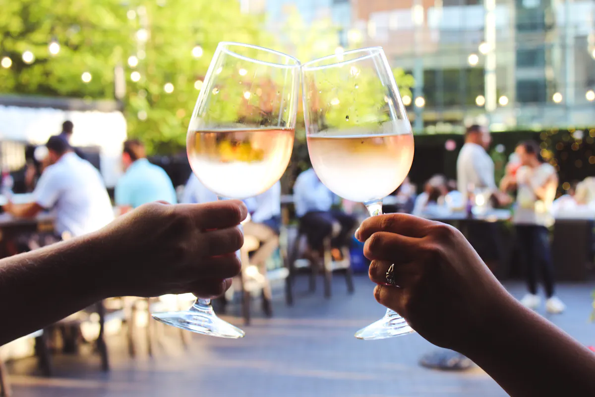 a person holding a wine glass